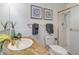Well-lit bathroom with a granite countertop, white tile, and a shower behind a glass door at 625 S Alton Way # 10D, Denver, CO 80247
