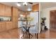 Cozy kitchen and dining area with wood cabinets and modern appliances at 625 S Alton Way # 10D, Denver, CO 80247