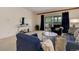 Inviting living room features a slider to the deck and stylish, comfortable furnishings at 625 S Alton Way # 10D, Denver, CO 80247