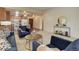 Comfortable living area featuring soft carpet, recessed lighting, and an open kitchen at 625 S Alton Way # 10D, Denver, CO 80247
