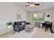 Comfortable living room with soft gray seating and a view to the outside at 625 S Alton Way # 10D, Denver, CO 80247