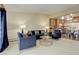Comfortable living room open to a kitchen and dining area at 625 S Alton Way # 10D, Denver, CO 80247