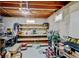Unfinished basement with exposed wood ceiling and shelving offers plenty of storage at 1425 S Newport St, Denver, CO 80224