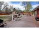 Spacious backyard deck with seating and gas grill overlooking a large yard perfect for outdoor living at 1425 S Newport St, Denver, CO 80224