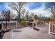 Outdoor deck and backyard featuring seating, a gas grill, and plenty of space for entertaining at 1425 S Newport St, Denver, CO 80224