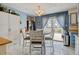 Bright eat-in kitchen with a round dining table, chairs, and natural light at 1425 S Newport St, Denver, CO 80224