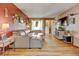 Cozy living room featuring hardwood floors and comfortable leather sectional sofa at 1425 S Newport St, Denver, CO 80224