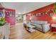 Spacious living room with ample seating, hardwood floors, and decor at 1425 S Newport St, Denver, CO 80224
