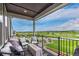 Comfortable balcony seating with views of green space and blue sky at 14998 Cast Pebble Cir, Parker, CO 80134