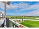 Stunning views from the balcony overlooking a lush green space and the neighborhood at 14998 Cast Pebble Cir, Parker, CO 80134
