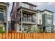 Charming two-story townhome with a balcony, fenced yard, and colorful siding at 14998 Cast Pebble Cir, Parker, CO 80134