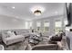 Spacious living room featuring comfortable seating and large windows offering natural light and views at 14998 Cast Pebble Cir, Parker, CO 80134