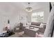 Stylish sitting room area featuring a comfortable sectional sofa and chandelier lighting at 14998 Cast Pebble Cir, Parker, CO 80134