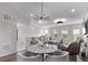 Open living space showcasing dining area and comfortable seating, perfect for entertaining at 14998 Cast Pebble Cir, Parker, CO 80134
