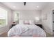 Inviting main bedroom featuring neutral decor, bright windows, and comfortable furnishings at 14998 Cast Pebble Cir, Parker, CO 80134