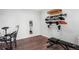 Finished basement with work out equipment, snowboards and musical instruments at 1767 S Sherman St, Denver, CO 80210