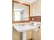 Elegant bathroom with a pedestal sink, mosaic tile accents, and a well-lit mirror at 1767 S Sherman St, Denver, CO 80210