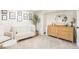 Sunlit Bedroom features a crib, dresser, rocking chair and ottoman, wall art, and a modern, decorative style at 1767 S Sherman St, Denver, CO 80210