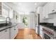 Bright, updated kitchen with stainless steel appliances and ample cabinet space at 1767 S Sherman St, Denver, CO 80210