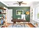 Stylish home office with a wooden desk, hardwood floors, and custom built-in shelving at 1767 S Sherman St, Denver, CO 80210