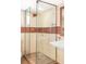 Stylish bathroom featuring a glass-enclosed shower with tiled walls and copper accents at 1767 S Sherman St, Denver, CO 80210