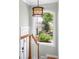 Bright stairway featuring a large window offering views of the well-maintained backyard at 1767 S Sherman St, Denver, CO 80210