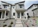 Stylish two-story home featuring stone accents, covered entrance, and contemporary design at 22813 E Tufts Ave # B, Aurora, CO 80015