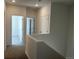 Upstairs hallway with carpet and white doors at 22813 E Tufts Ave # B, Aurora, CO 80015
