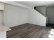 Open living space with wood floors and staircase, plenty of natural light at 22813 E Tufts Ave # B, Aurora, CO 80015