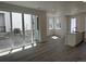 Open living space with access to outdoor patio through sliding glass doors, modern finishes at 22813 E Tufts Ave # B, Aurora, CO 80015