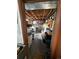 A cluttered basement features exposed beams, storage containers, and a laundry area at 1265 Yates St, Denver, CO 80204