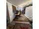 Spacious basement setup with a vintage patterned rug, recording/music equipment, and storage at 1265 Yates St, Denver, CO 80204
