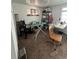 Functional bedroom space, carpeted, with great light, and an ironing board at 1265 Yates St, Denver, CO 80204