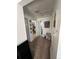 Hallway view with access to other rooms, carpeted flooring, and neutral decor at 1265 Yates St, Denver, CO 80204