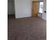 Spacious living room featuring plush carpeting and bright natural light at 1265 Yates St, Denver, CO 80204