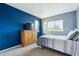 Bedroom with a large window, carpeted floors, and a closet at 6774 St Vrain Ranch Blvd, Firestone, CO 80504