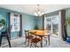 Cozy dining room with wooden table, chairs, and a view of the backyard at 6774 St Vrain Ranch Blvd, Firestone, CO 80504