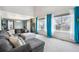 Bright living room boasts a large gray couch, soft natural light, and an inviting open-concept design at 6774 St Vrain Ranch Blvd, Firestone, CO 80504