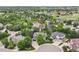 Aerial view of neighborhood featuring large homes, mature trees and landscaping at 6175 Puma Sands, Lone Tree, CO 80124