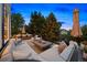 Backyard with a sectional and fire pit perfect for relaxing at 6175 Puma Sands, Lone Tree, CO 80124
