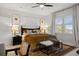 Bright bedroom with a ceiling fan, natural light, and stylish furnishings at 6175 Puma Sands, Lone Tree, CO 80124