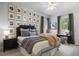 Cozy bedroom featuring a ceiling fan, stylish décor, and natural lighting at 6175 Puma Sands, Lone Tree, CO 80124