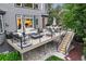 Well-designed deck featuring comfortable seating, a fire pit, an outdoor dining area, and string lights at 6175 Puma Sands, Lone Tree, CO 80124