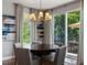 Dining room features a chandelier and sliding doors leading to an outdoor seating area at 6175 Puma Sands, Lone Tree, CO 80124