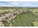 Scenic landscape featuring an escarpment with shrubbery and trees at 6175 Puma Sands, Lone Tree, CO 80124