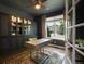 Stylish home office featuring custom cabinetry and a large window at 6175 Puma Sands, Lone Tree, CO 80124
