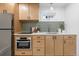 Functional basement kitchen with light wood cabinets at 448 Brook Rd, Evergreen, CO 80439