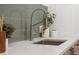 Stylish basement sink with a modern faucet and green tile backsplash at 448 Brook Rd, Evergreen, CO 80439