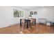 Bright dining area with hardwood floors and a view from a nearby window at 448 Brook Rd, Evergreen, CO 80439