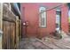 Backyard featuring a wooden fence, hardscape and the exterior of the home at 1103 Lipan St, Denver, CO 80204